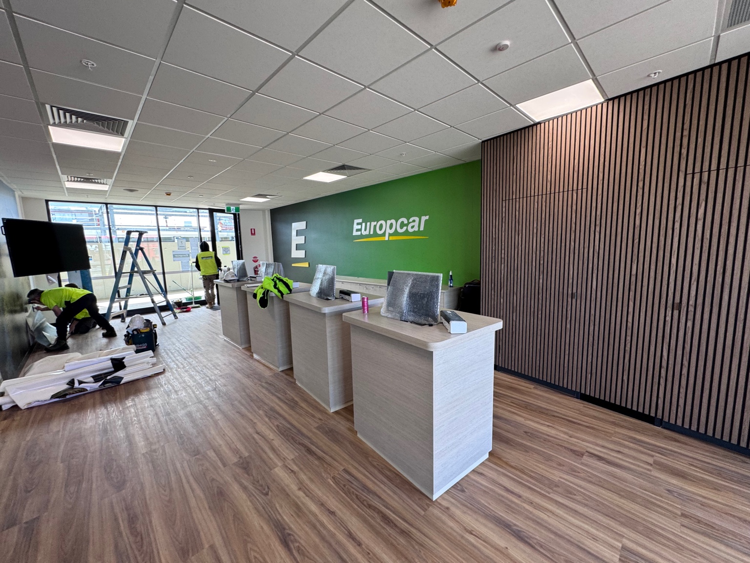 Europcar Hobart counters and green feature wall